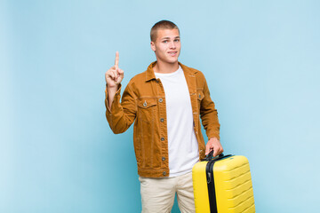 young blonde man feeling like a happy and excited genius after realizing an idea, cheerfully...