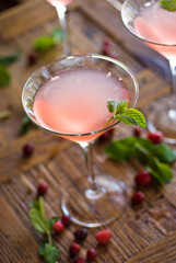 Cocktails. Alcoholic Drinks made with gin, vodka, rum or whiskey mixed with soda water, fruit juices and garnishes with limes and cherries. Classic American bar drinks.
