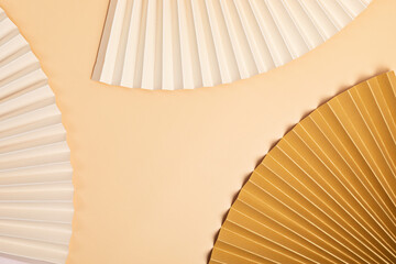 Abstract background with textured paper fans. Festive celebration backdrop. Mockup for product...