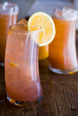 Cocktails. Alcoholic Drinks made with gin, vodka, rum or whiskey mixed with soda water, fruit juices and garnishes with limes and cherries. Classic American bar drinks.