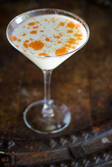 Cocktails. Traditional American drinks made by bartenders or mixologists in speakeasy or upscale bars and taverns. Cocktails served in chilled cocktail glasses and garnished with fruit.