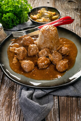 Minced meat balls in mushroom sauce.