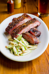Pork ribs, barbecue style. Classic Traditional Texas Smokehouse favorite menu item: Baby Back pork ribs. Slow cooked in seasoned smoker over mesquite wood chips covered in homemade bbq sauce. 