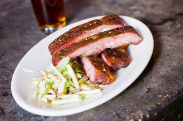 Pork ribs, barbecue style. Classic Traditional Texas Smokehouse favorite menu item: Baby Back pork ribs. Slow cooked in seasoned smoker over mesquite wood chips covered in homemade bbq sauce. 