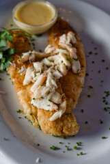 Grilled Red Snapper, fresh fish. Traditional Classic American or French Seafood Restaurant menu item, whole grilled fresh caught halibut or sea bream Fish served with chilled gazpacho. 