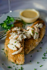 Grilled Red Snapper, fresh fish. Traditional Classic American or French Seafood Restaurant menu item, whole grilled fresh caught halibut or sea bream Fish served with chilled gazpacho. 