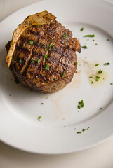 Steaks. Grade A grass fed angus beef steaks. Tenderloin, filet mignon, New York strip, bone in rib-eye grilled medium rare on outdoor wood-fired grill. Classic American steakhouse entree favorite.