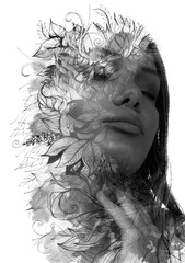 A monochrome floral paintography portrait of a woman with closed eyes on white background