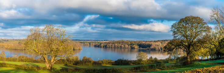 Naklejka na ściany i meble A panorama view across the northern half of Pitsford Reservoir, UK in winter