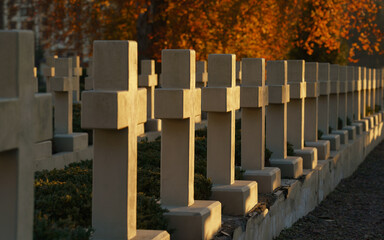 view of Polish Orlat Cemetery stone graves crosses at sunset