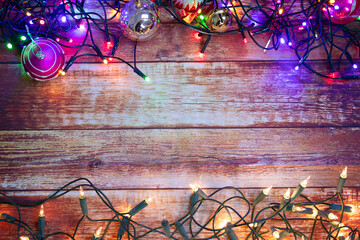 Christmas theme on a wooden background, with decorations and lights 
