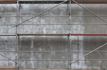 Obraz premium The exterior of the building wall on a grey construction 
