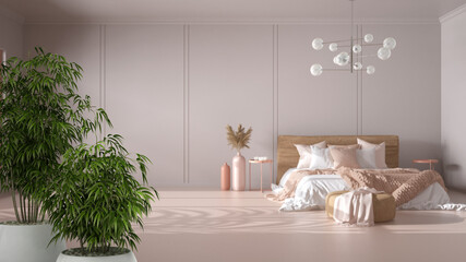 Zen interior with potted bamboo plant, natural interior design concept, empty bedroom, double bed with blanket, linens, pillows, pouf and decor. Glass chandelier, interior design idea