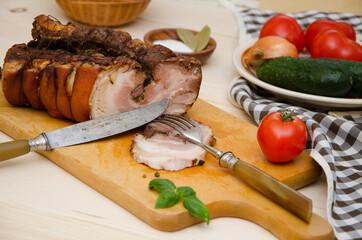meat and vegetables baked piece of pork chopped on the board close-up