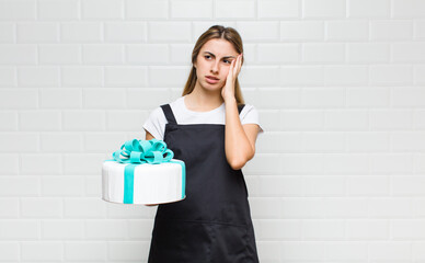 blonde pretty woman feeling bored, frustrated and sleepy after a tiresome, dull and tedious task,...