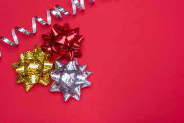 beautiful bow from a gift ribbon on a red background