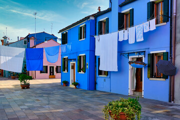 Fototapeta na wymiar Coloured fisherman's houses and laundry day drying