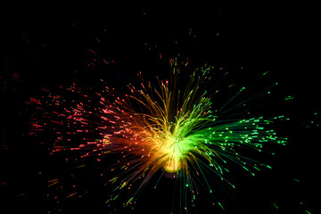 Optical fiber network cable on black background.
