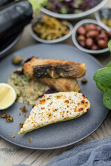 Fried Sturgeon Fish with Cheesy Baked Courgette and Caper Sauce