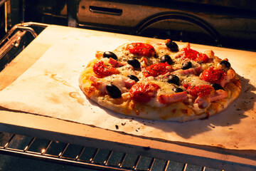 Cooking homemade pizza in the oven