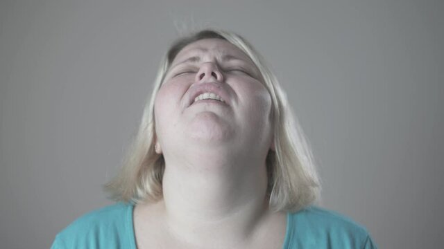Portrait of a very displeased fat woman.