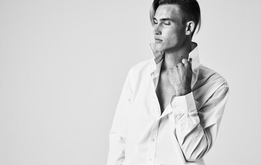 elegant man in shirt with tie light background portrait cropped view