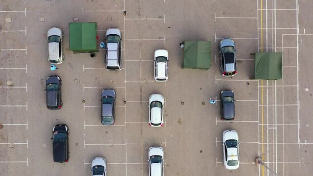 Corona Virus Vaccination Drive Through, With Medical Teams Approaching And Treating Car Passengers.
