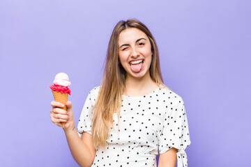 blonde pretty woman with cheerful, carefree, rebellious attitude, joking and sticking tongue out,...