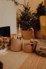 Jute baskets placed next to the fireplace, a cozy place in the living room