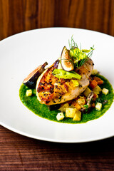 Chicken breast, pan seared to a crispy golden brown in brown butter and served with farm fresh organic vegetables: carrots, Brussels sprouts and green beans. Classic American restaurant favorite.