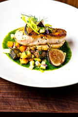 Chicken breast, pan seared to a crispy golden brown in brown butter and served with farm fresh organic vegetables: carrots, Brussels sprouts and green beans. Classic American restaurant favorite.