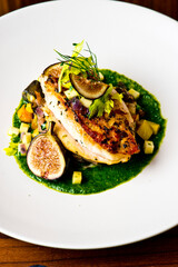 Chicken breast, pan seared to a crispy golden brown in brown butter and served with farm fresh organic vegetables: carrots, Brussels sprouts and green beans. Classic American restaurant favorite.