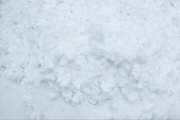 fresh snow background. high angle view of snow texture Natural winter background with snow drifts and falling snow. 