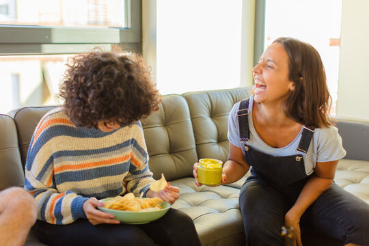 Two Friends Girls Eating Mexican Food At Home