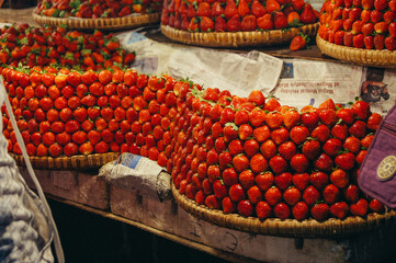 a group of baskets of strawberries
