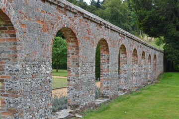 Fototapeta na wymiar Rustic Arched Wall in English Countryside