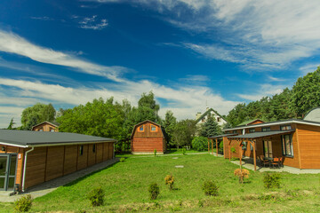 wooden cottage apartments in Nordic architecture style in clean nature summer environment space vacation and relaxation place concept