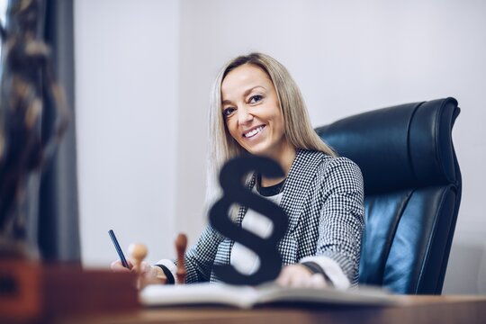 Smiling, Satisfied Female Lawyer Notary Is Working In Her Notary Office.