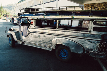 an old bus parked in a parking lot