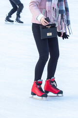 Naklejka premium woman ice skating on an ice rink. hobbies and leisure. winter sports