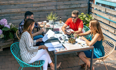 Group of people in a informal meeting on the terrace of the office