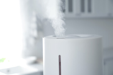 Modern air humidifier in kitchen, closeup view