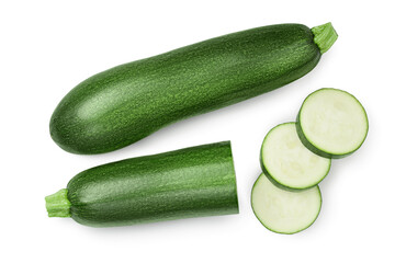 Fresh whole and sliced zucchini isolated on white background with clipping path and full depth of field. Top view. Flat lay