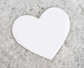 The outline of a heart in the snow, winter background for design