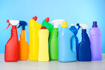Bottles of different cleaning products on light table