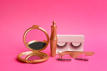 Magnetic eyelashes and accessories on crimson background