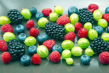 Fototapeta na wymiar lots of fresh different berries. useful vitamin healthy food fruit. healthy vegetable breakfast