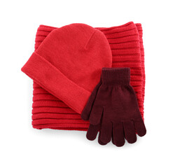 Woolen gloves, hat and scarf on white background, top view. Winter clothes