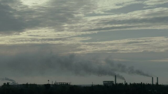 Smoke from industrial pipes. Pollution concept. Dirty air background.