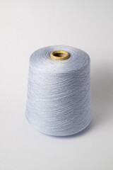 bobbin of yarn on a white background. Side view.Textile reel on isolated white back.